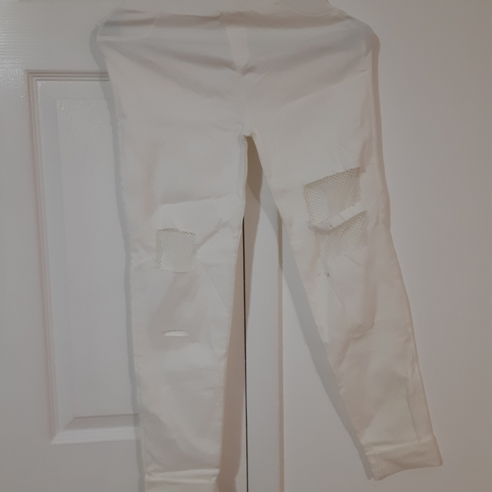 White stretch material ripped knees